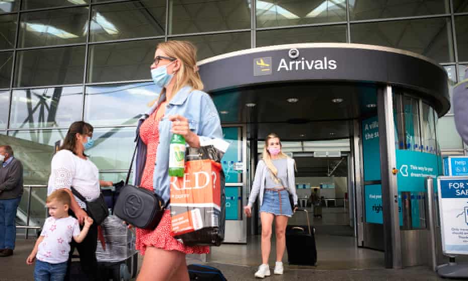 Passengers arrive back to Stansted airport in Essex