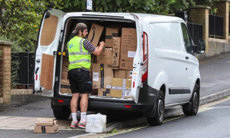 A delivery driver unpacks parcels