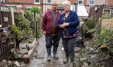 Stephanie and David Winnard stand in their garden