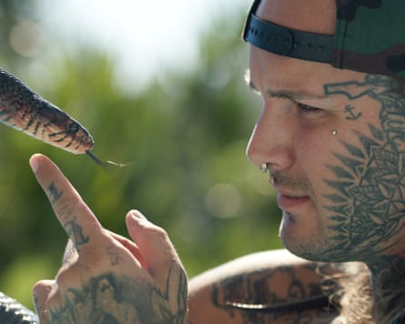 Tyler Nolen with indigo snake in Monsters of God.