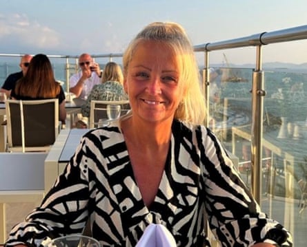 Anita Rose smiling sat on a balcony somewhere sunny