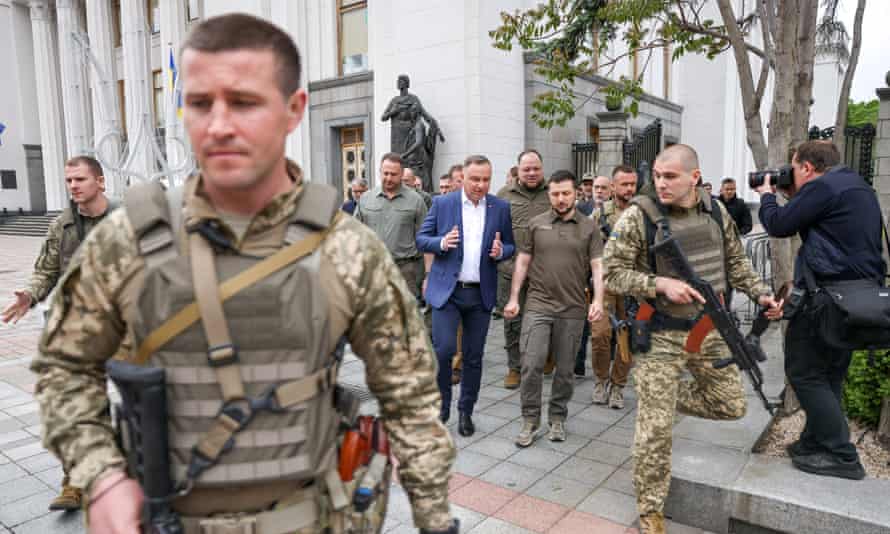 Poland’s president Duda and Ukrainian president Zelenskiy walk at a street in Kyiv on Sunday.