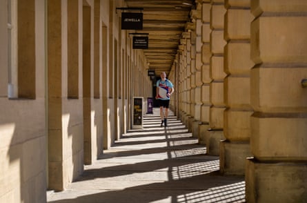 Collins running through the Piece Hall cloisters.