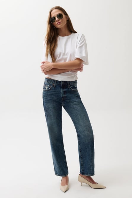 model wearing white t-shirt and jeans