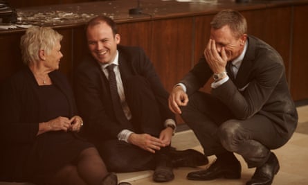 Rory Kinnear on the set of Skyfall with Judi Dench and Daniel Craig, all three sitting on the floor/crouching