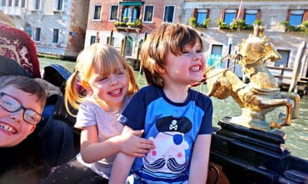 Emma Harris’s children (from left) Oli, Charlotte and Dylan, on a gondola ride in Venice.