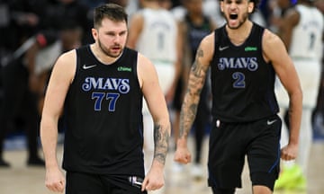 The Mavericks’ Luka Dončić, left, celebrates after hitting the winning three in Friday’s Game 2 of the Western Conference finals.