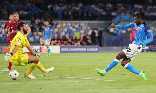 Andre-Frank Zambo Anguissa slots the ball past Liverpool goalkeeper Alisson to score Napoli’s second goal.