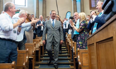 Brexit party leader Nigel Farage (C) prepares to make a speech in London on 27 August