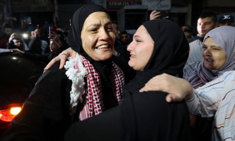 Rawda Abu Ajamieh, left, hugs a relative after her release from an Israeli prison as part of the truce agreement