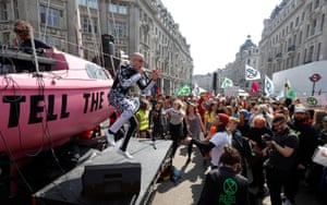 People sing at the Extinction Rebellion protest