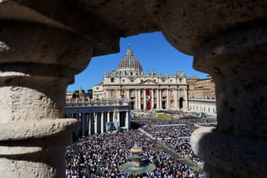 A view of St Peter’s basilica with a large crowd in front