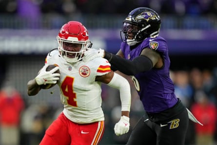 Kansas City Chiefs wide receiver Rashee Rice, left, is tackled by Baltimore Ravens linebacker Patrick Queen during the first half of the AFC Championship Game in January.