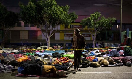 Haitian and African people seeking asylum in the US sleep on a street near a migration office in Tijuana in 2016.