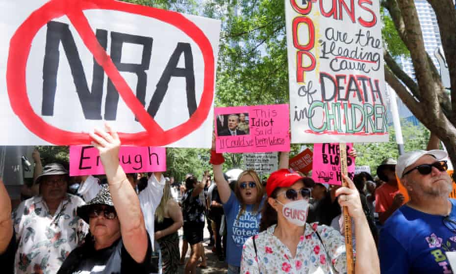 People protest against gun laws outside the National Rifle Association convention in Houston.