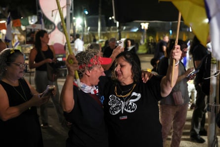 People celebrate after Trump’s announcement at the ‘hostages square’ in Tel Aviv.