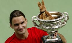 Roger Federer holds the trophy aloft after beating Marat Safin in the 2004 Australian Open final