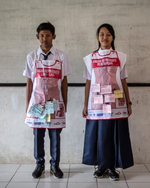 A boy and girl taking part in sex education lessons at SMPN 22 school in Jakarta