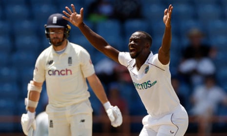 Kemar Roach celebrates taking the wicket of England's Jack Leach. 