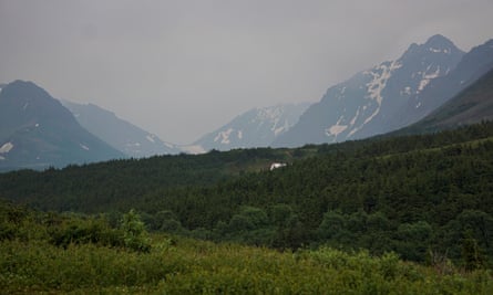 A general view of the mountain valley obscured by smoke taken from the Glen Alps trailhead of Chugach state park in Anchorage, Alaska, on 29 June.