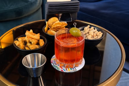 A Negroni with plantain crisps, cashews and savoury pastries at Velvet, Verona