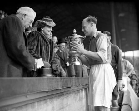 George Male receives the Football League (South) War Cup after the 1953 final between Arsenal and Charlton at Wembley.