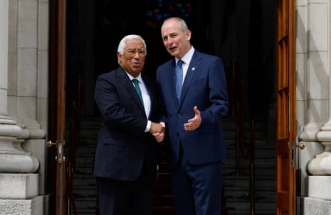 Ireland’s prime minister (Taoiseach) Micheál Martin and European Council president António Costa shake hands.