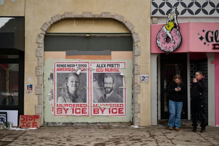 Posters dedicated to Renee Good and Alex Pretti on a commercial building
