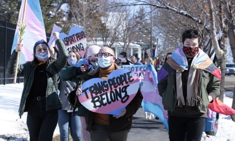 Protesters march from the South Dakota governor’s mansion to the Capitol in Pierre, South Dakota.
