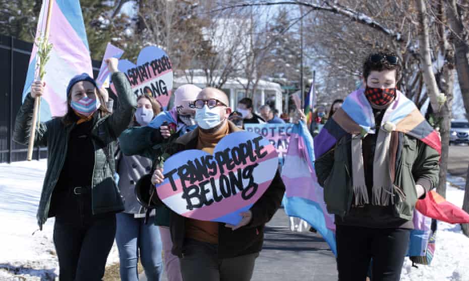 Advocates for transgender people march through South Dakota on 11 March to protest an order prohibiting trans girls from playing on girls’ teams. 