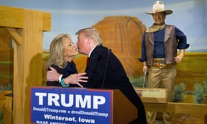 Donald Trump kisses Aissa Wayne as a wax statue of John Wayne watches, in Iowa in January 2016.