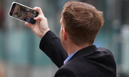 Belfield videos himself as he arrives at court in July.