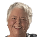 Smiling woman with short white hair and red lipstick