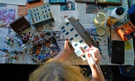 A volunteer works on a 1/100th scale replica of a building which has been created for the new ‘model of a model’ within Wimborne Model Town in Dorset