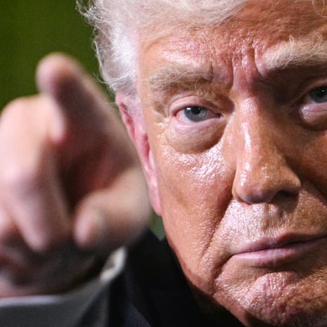 A close-up of Donald Trump's face and his finger pointing
