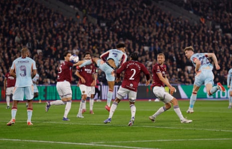 Brentford’s Nathan Collins heads at goal before Igor Thiago scores their first goal.