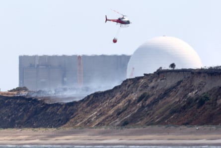 A firefighting helicopter flies near Sizewell nuclear plant