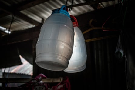 Containers hang from the rafters of Jasmine Durana's house