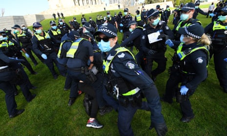 Protesters scuffle with Victorian police at the anti-lockdown ‘Freedom Day’ protest on Saturday.