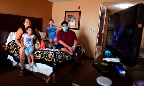 Ruben Navarette, 14, (right) sits in a hotel room with his aunt Jamie Smith and cousins Julissa (2nd from right) and Jeorgina, where they have been temporarily located in Fresno, California after he had to drive for the first time when escaping the Creek Fire on Labour Day from his home in Tollhouse, California.