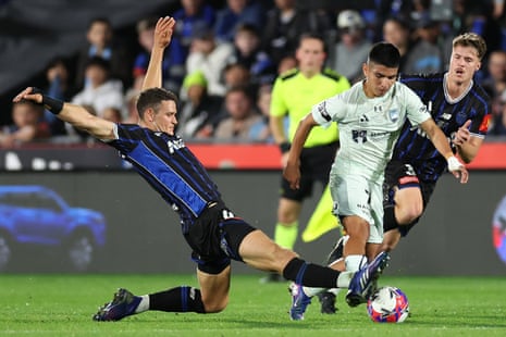 Piero Quispe is challenged by Louis Verstraete of during the A-League Men grand final