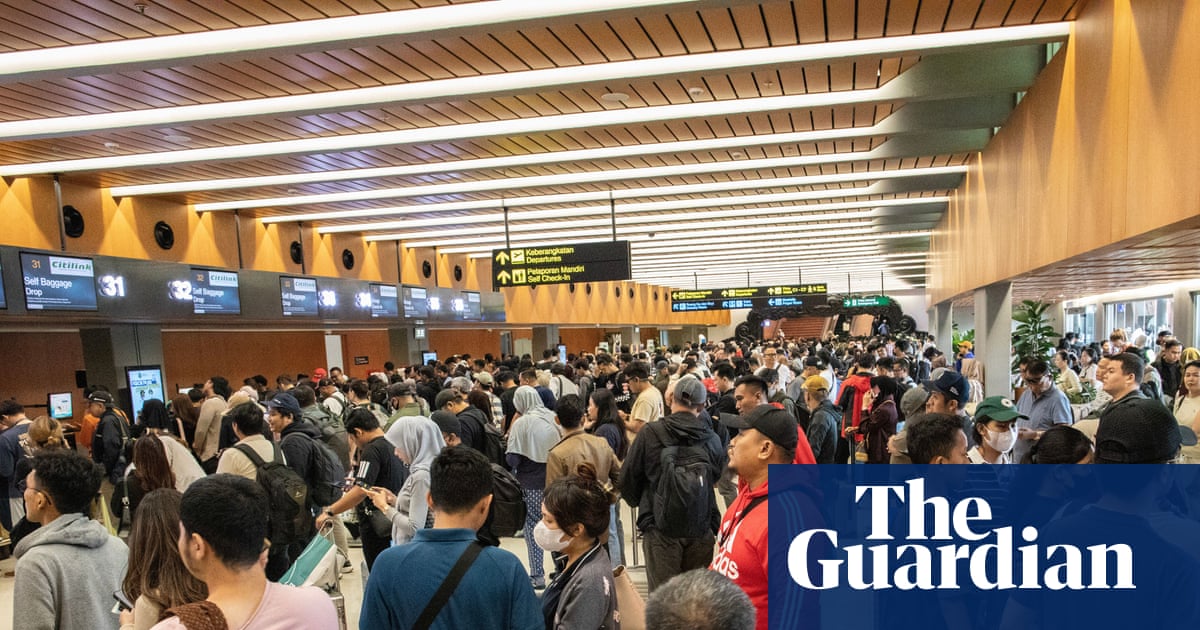 Volcano eruption in Indonesia leaves 170,000 travellers stranded as eight airports closed