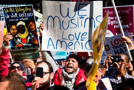 Demonstrators chant during a #NoMuslimBanEver rally on 18 October