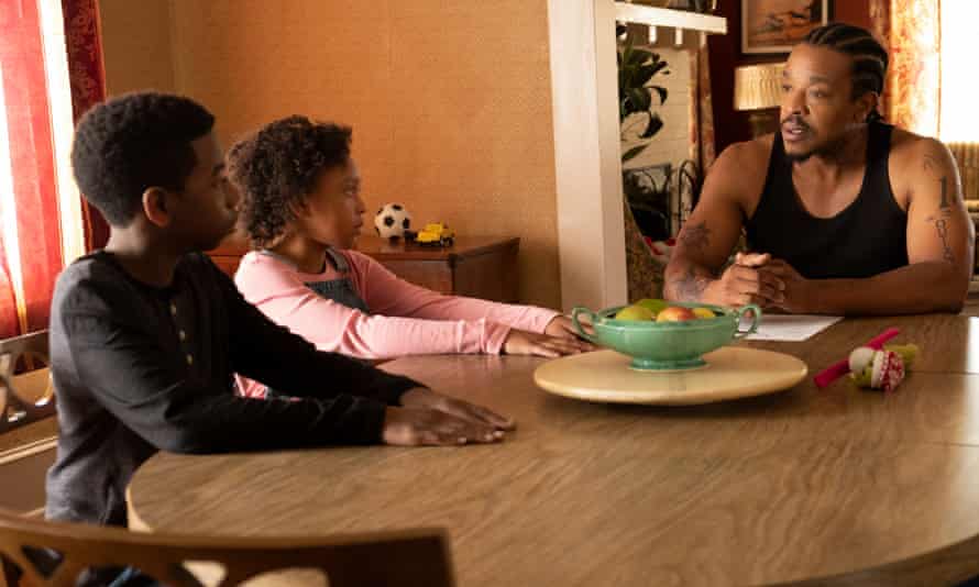 Russell Hornsby, right, in The Hate U Give film adaptation (2018).