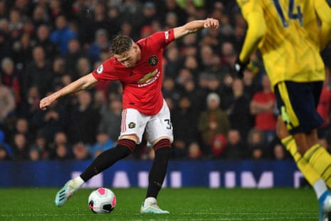 Manchester United’s Scotland midfielder Scott McTominay shoots to score the opening goal.