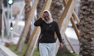 A woman cries asking for her son as she walk near the scene of the attack in the French resort city of Nice, southern France