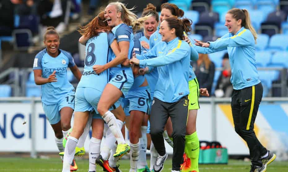 Manchester City Women players celebrate as they win the WSL title by beating Chelsea Ladies FC 2-0.