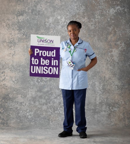 Nurse Annette Heslop holding a Proud To Be In Unison poster 