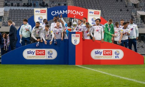 Fulham prepare to lift the Championship trophy last May.