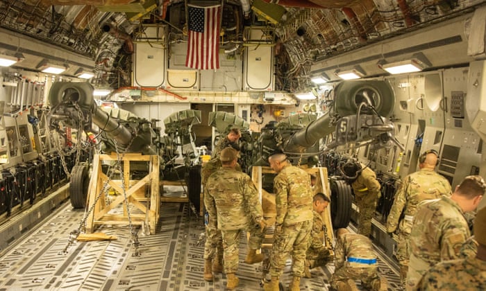 US marines load an M777 towed 155 mm howitzer into the cargo hold of a US Air Force C-17 Globemaster III transport plane, to be delivered to Europe for Ukrainian forces.